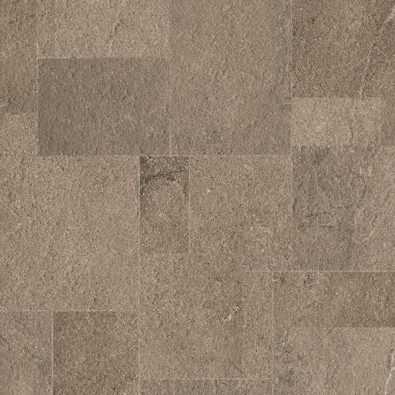Dekor Authentic Brown Carreaux de porcelaine taupe à l'effet pierre naturelle brute et pose rectangulaire.