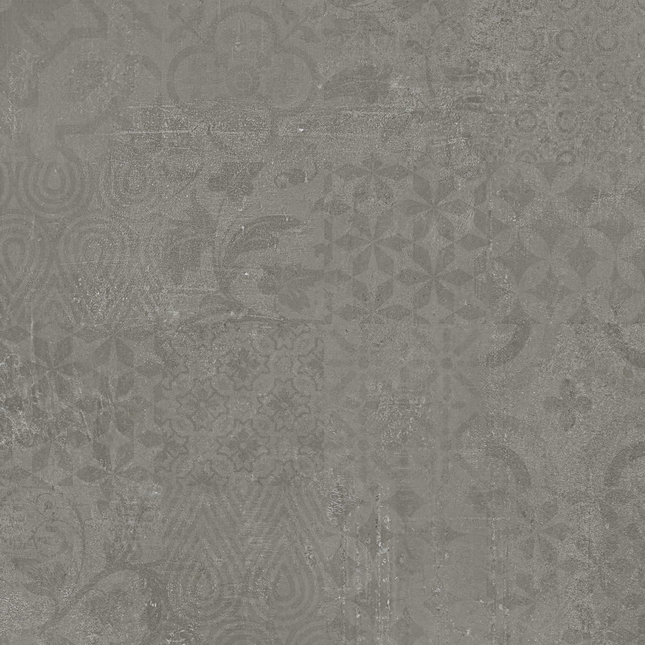 : Carrelage anthracite aux motifs ornementaux subtils.