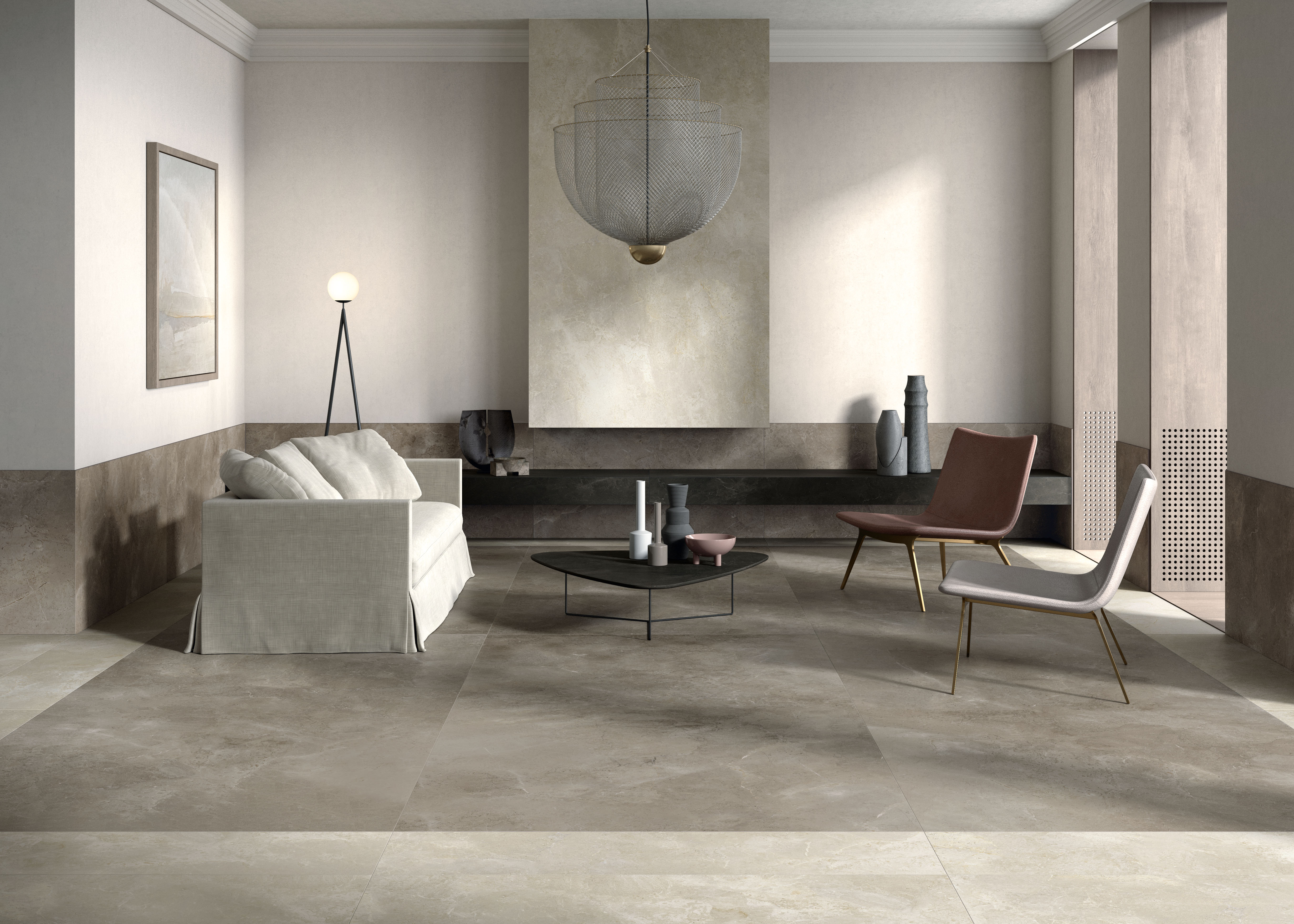 Modernes Wohnzimmer mit großformatigen Porcelaingres Fliesen in Betonoptik.