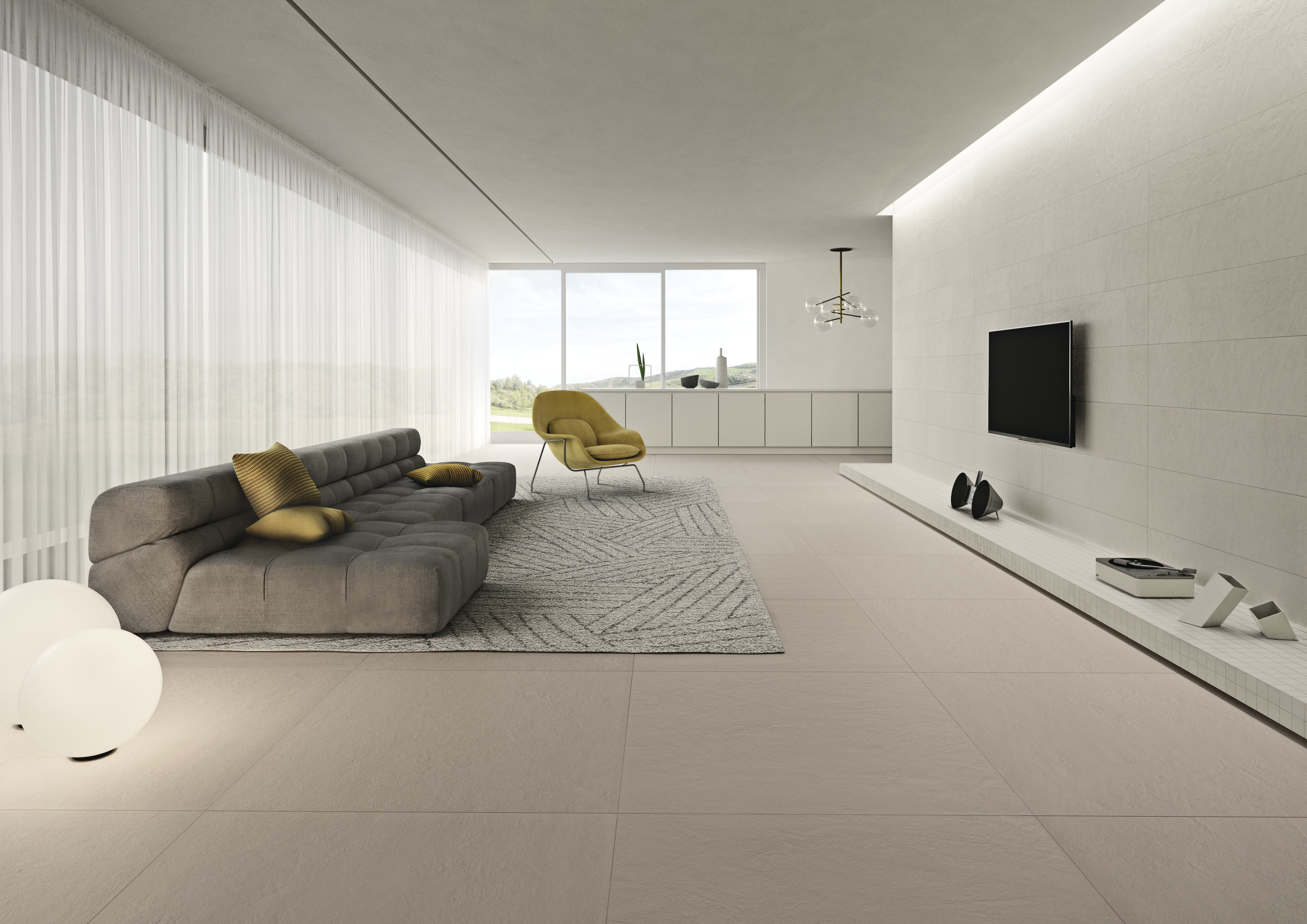 Salon moderne avec carrelage Porcelaingres clair et mobilier minimaliste.