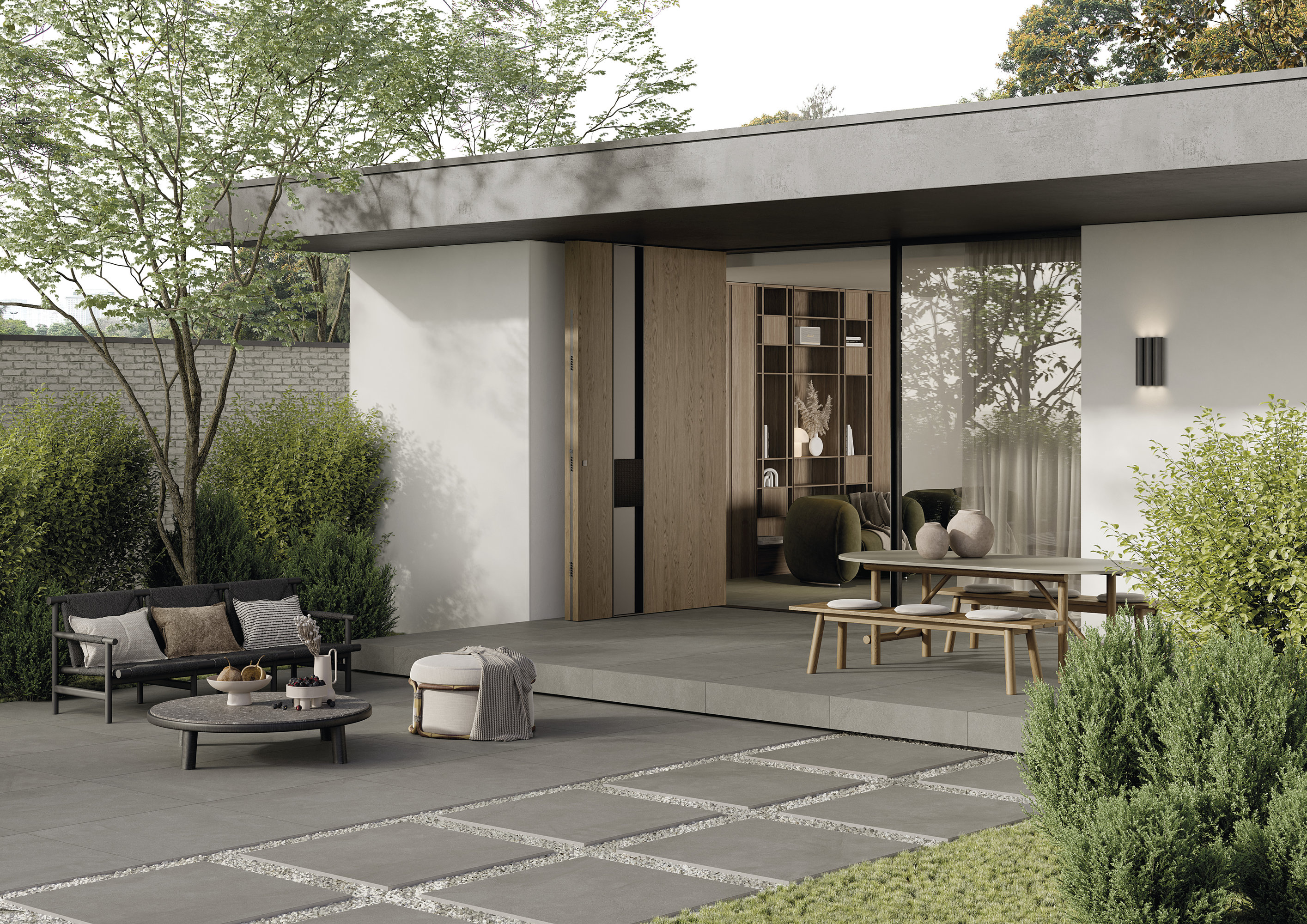 Großformatige Outdoor-Fliesen und Gartenplatten in Grau für eine moderne Terrassengestaltung.