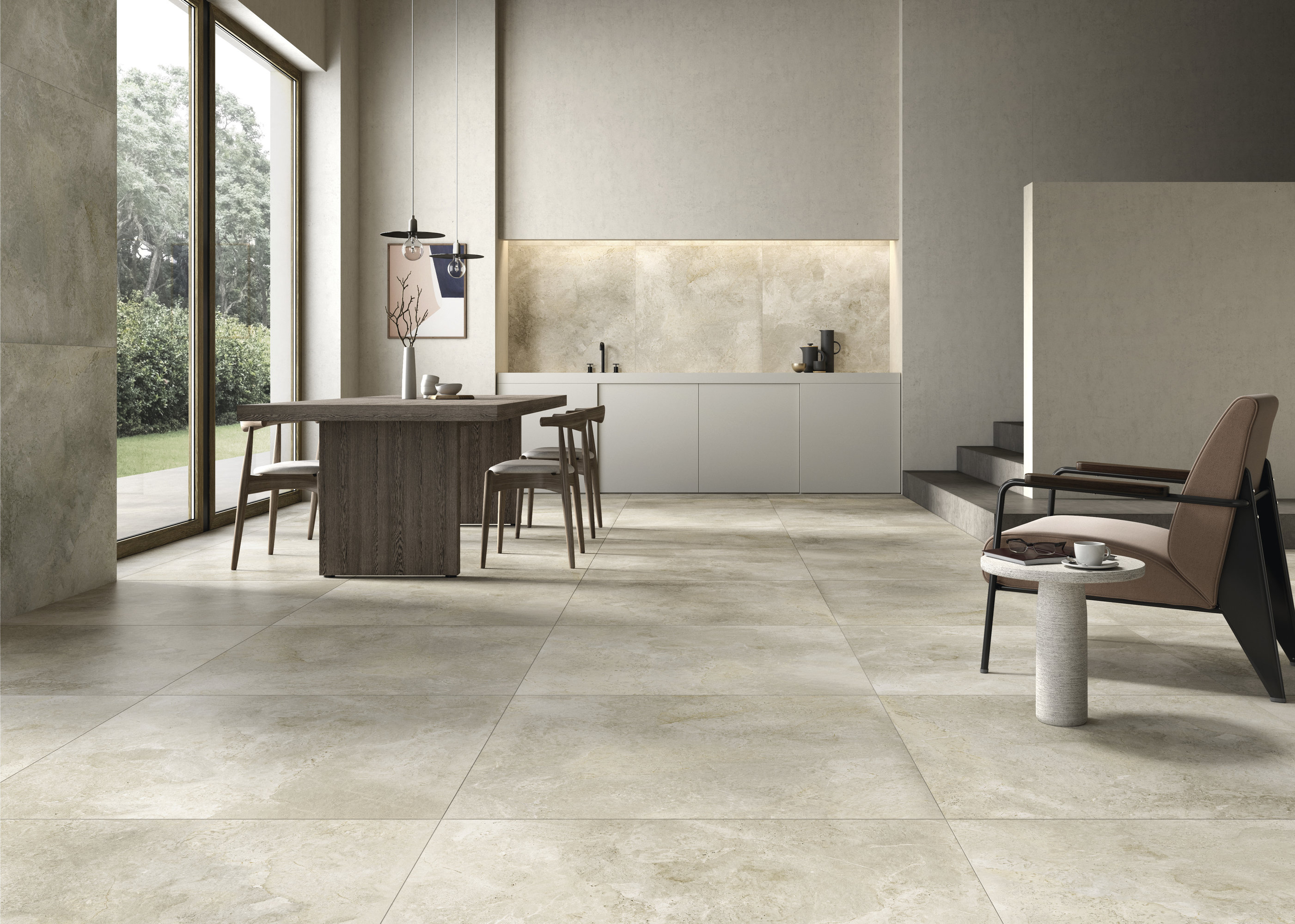 Carrelage sol grand format gris clair premium dans un espace de vie moderne et ouvert.