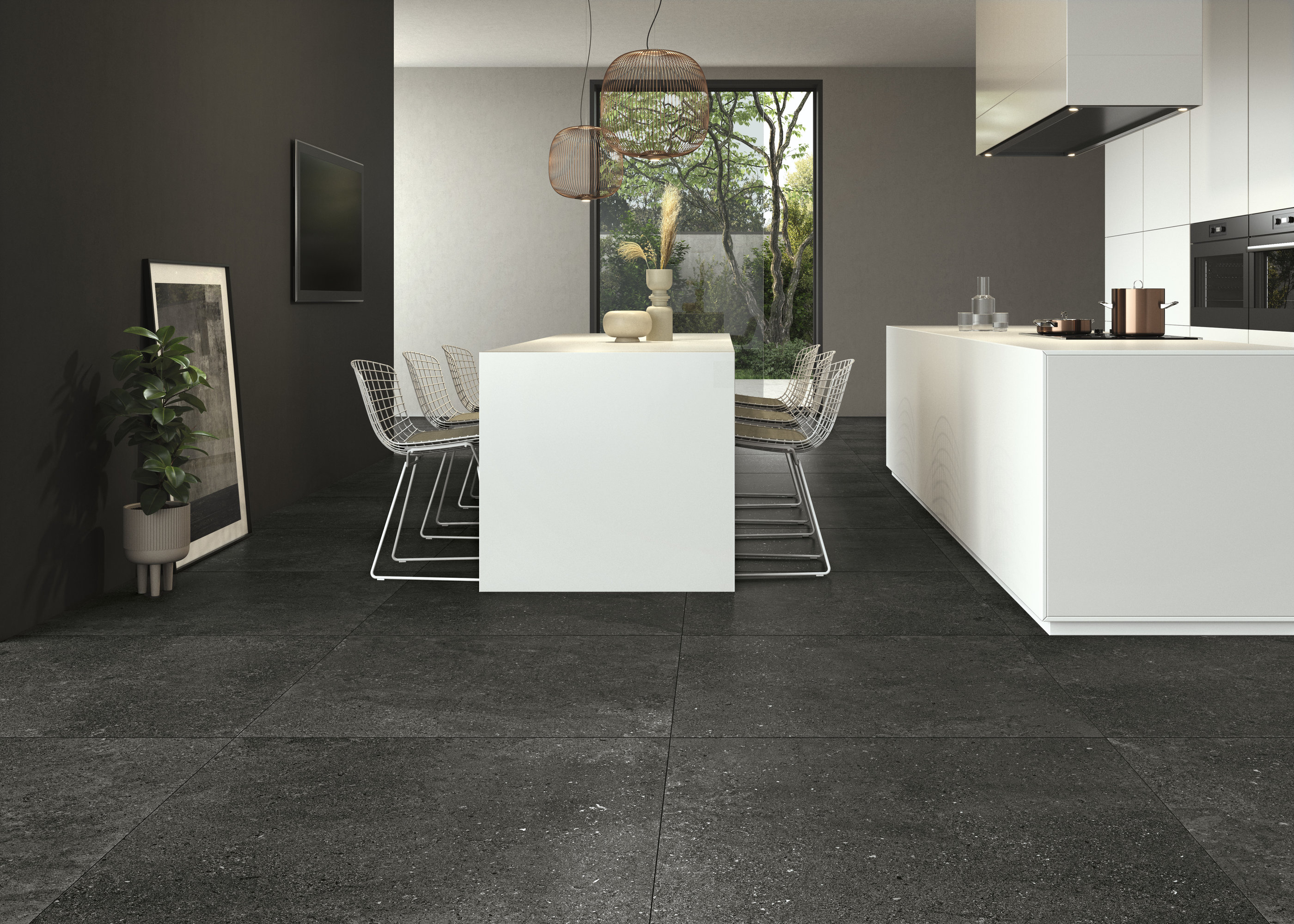 Carreaux grand format gris foncé dans une cuisine moderne avec des éléments blancs.