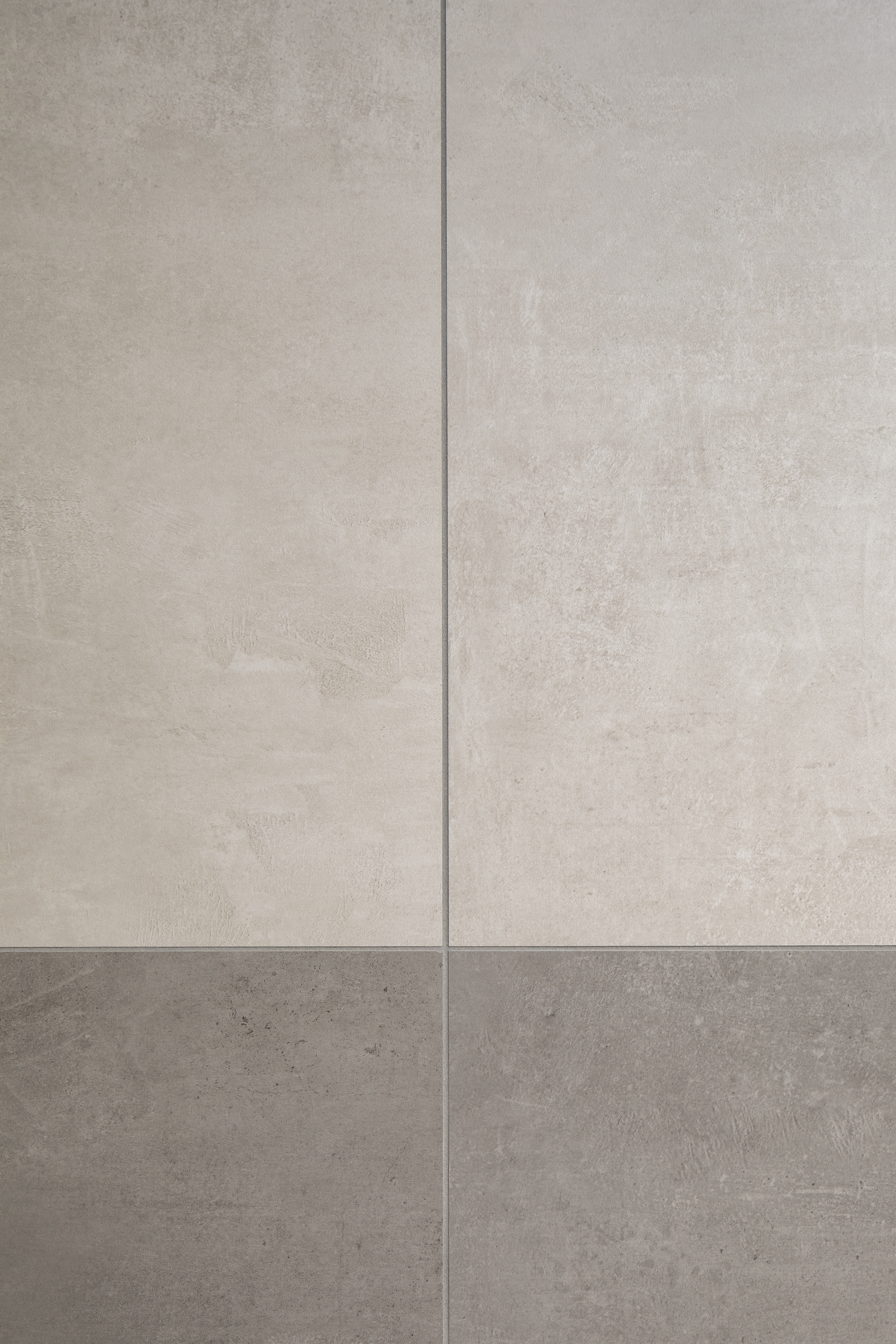 Carreaux aspect béton gris clair et foncé pour intérieurs et extérieurs modernes.